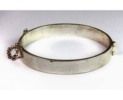 A heavy silver bangle, L. 19cm.