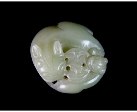 A 19th / early 20th century Chinese nephrite jade figure of a coiled young dragon, Dia. 4.5cm.