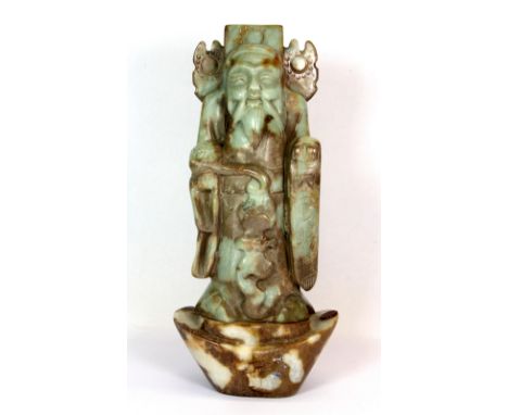 A Chinese carved jade figure of a lucky character, H. 30cm.
