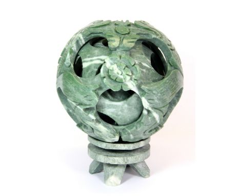 A large Chinese carved jade / hardstone concentric ball, Dia. 17cm.