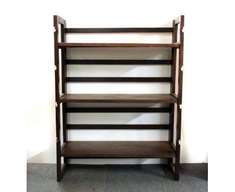 A useful folding shelf unit, H. 94cm.