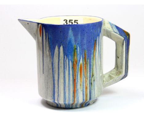 A Clarice Cliff Art Deco drip glazed milk jug, H. 12.5cm.