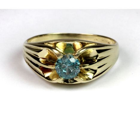 A gentleman's 9ct yellow gold (worn mark) ring set with a brilliant cut blue topaz (R).