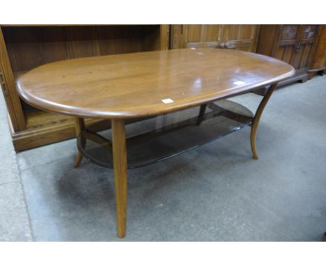 An Ercol Golden Dawn elm oval coffee table 