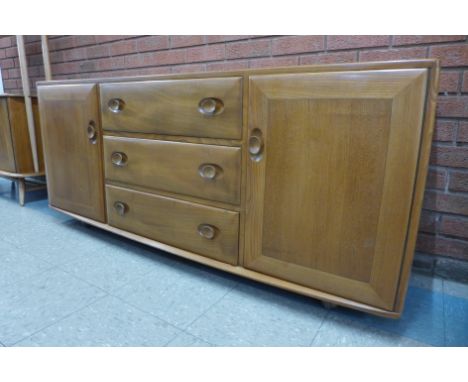 An Ercol Blonde elm 455 model Windsor sideboard 