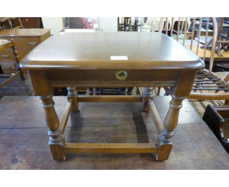 An Ercol Golden Dawn elm stool 