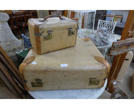 A vintage travel trunk and matching vanity case 