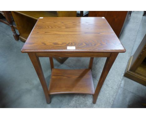 An Ercol Golden Dawn elm side table 