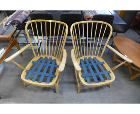 A pair of Ercol Blonde beech 477 model Windsor armchairs 