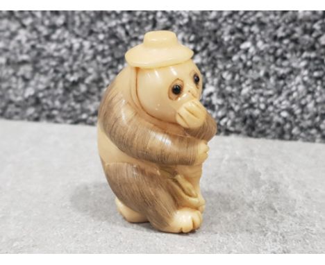 Handcarved horn Netsuke - panda bear with beaded eyes