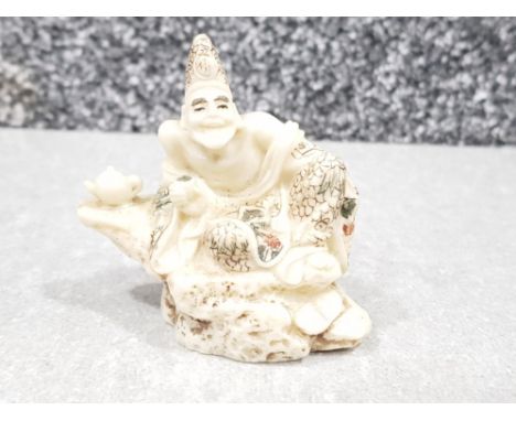 Japanese handcarved bone Netsuke in the form of Japanese man drinking