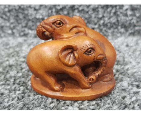Handcarved hardwood Netsuke in the form of two elephants