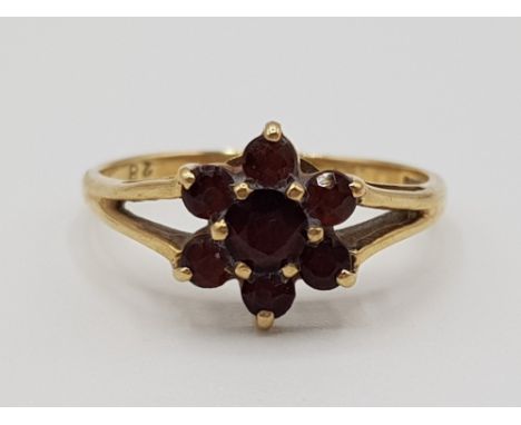 A 9ct yellow gold and garnet cluster ring size N1/2 1.67g grose