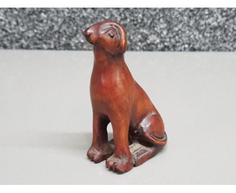 Finely carved Hardwood netsuke depicting sitting dog