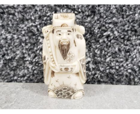 Japanese handcarved bone Netsuke in the form of a village elder
