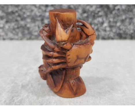 Handcarved hardwood Netsuke in the form of a crab