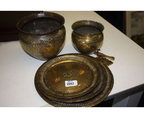Two brass Indian ornate planter pots 5" and 7" high, three Indian brass plates and a brass Bird ornament 3" high