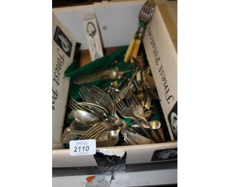 A quantity of silver and silver plated including old forks and spoons, two knife rests, ornate teaspoons, silver plate dinner