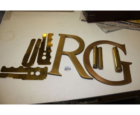 A quantity of Brass including two Capital letters, three trench art items and button guards