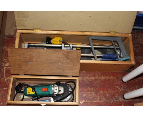A manual tile cutter and electric angle grinder 