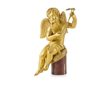  FRENCH GILT BRONZE AND ROUGE MARBLE ALLEGORICAL FIGURE 19TH CENTURY modelled as a seated putto holding gardening tools, on a