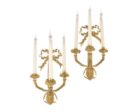  PAIR OF LOUIS XVI STYLE ORMOLU THREE LIGHT WALL LIGHTS 19TH CENTURY with ribbon-tied backs issuing three scrolling candle br