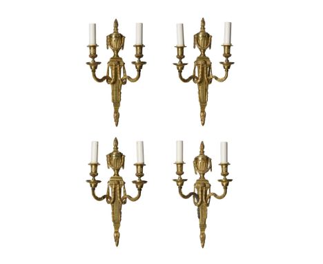  SET OF FOUR FRENCH GILT BRONZE WALL LIGHTS 19TH CENTURY in the Louis XVI style, of Neoclassical form, each with a torch and 