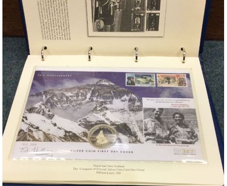 A folio of autographed First Day Cover coin and stamp sets etc. 