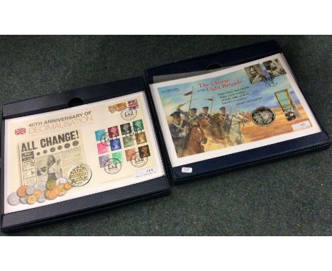 A boxed commemorative 'The Charge of The Light Brigade' silver coin set together with a similar '40th Anniversary of Decimali