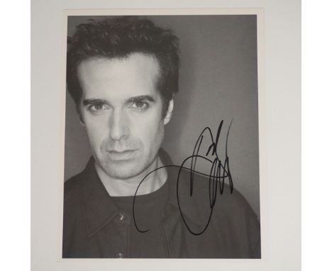This 8"L x 10"H black and white photograph of renowned magician David Copperfield is hand-signed and comes with a Certificate