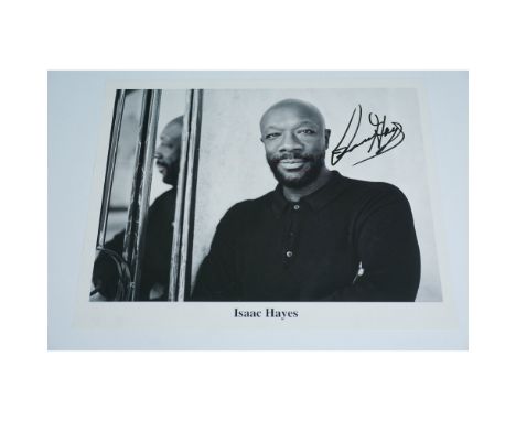 A black and white 8" x 11" photograph of legendary musician and actor Isaac Hayes, featuring his bold autograph in black ink.