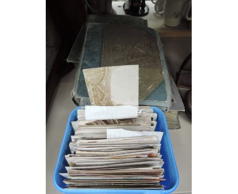 A selection of vintage postcards, loose and in albums, various including humorous, Lakes interest and Lusitania