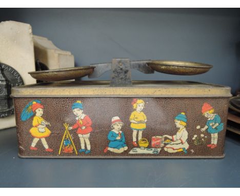 A vintage novelty biscuit tin for William Crawford & Sons, modelled as weighing scales of childhood interest     