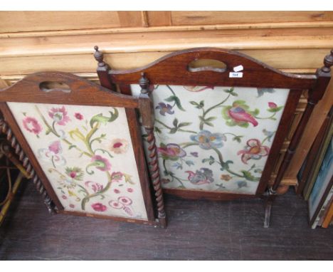 A late 19th century mahogany firescreen with inset tapestry panel, a similar period oak firescreen with inset tapestry panel 