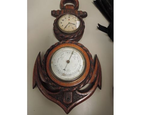 An early 20th century oak frame marine inspired barometer of anchor design having Zenith inset clock and aneroid barometer