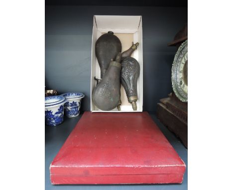 A cased set of fish knives and forks and a selection of vintage powder flasks
Condition: Some corrosion to the larger of the 