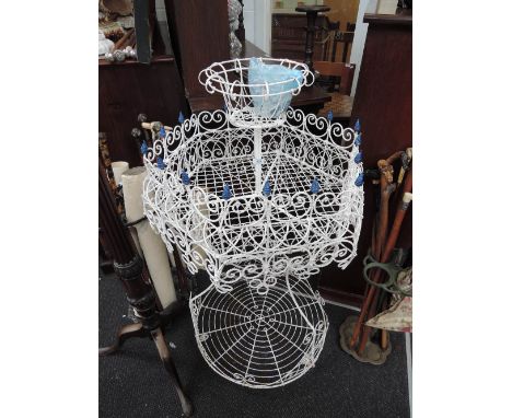 A vintage white painted wireworks jardiniere garden stand of mult-tiered form