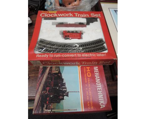 A Triang Hornby OO gauge clockwork converted to electric train set RS87, boxed and a Mehano Tehnika HO scale part train set, 