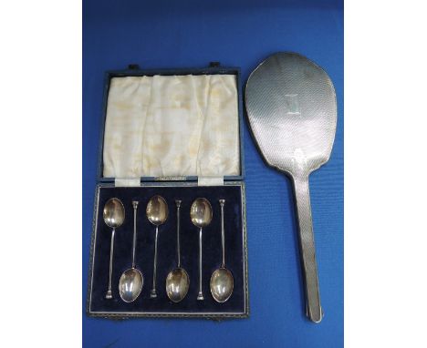 A cased set of six silver coffee spoons having enamelled bowls with floral decoration and shaped knops, Birmingham 1962, Henr