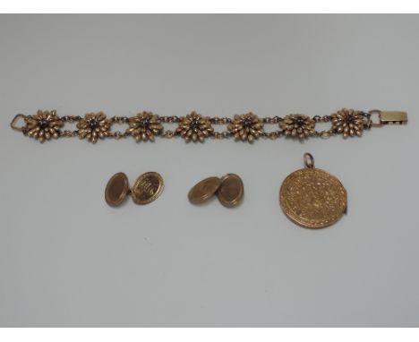 A pair of oval 9ct gold cufflinks having chain connectors with engine turned decoration and initials 'DW',  approx 3.3g, a pl