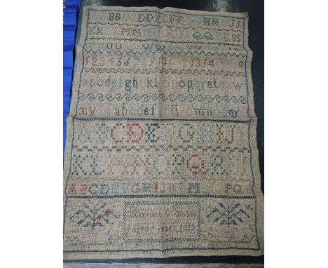 A mid 19th Century sampler embroidered 'Harriet Snow aged 9 years 1853'