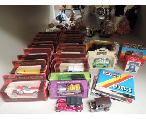 A shelf of mixed die-casts including Matchbox, Models of Yesteryear etc, most boxed