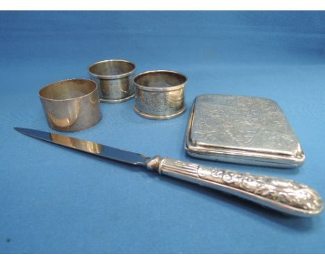 A selection of HM silver including a pair of napkin rings, a small cigarette case having scroll decoration, another plain nap