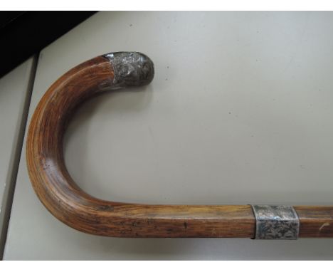 A vintage oak walking stick having HM silver mounts