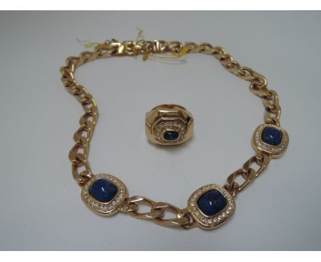 A 1980's necklace by Grosse having heavy curb chain with three inset links of lapis lazuli with diamante surround, and a matc