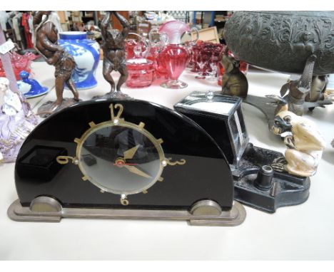 A 1920's/1930's Art Deco mantel clock and a similar period cigarette dispenser of primate design