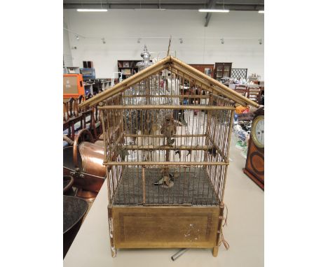 A late 19th century Swiss Automaton clockwork, modelled as bird in a gilded cage by Geo Baker &amp; Co, Geneva