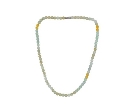 A jade necklace - of small uniform beads, length 44cm.