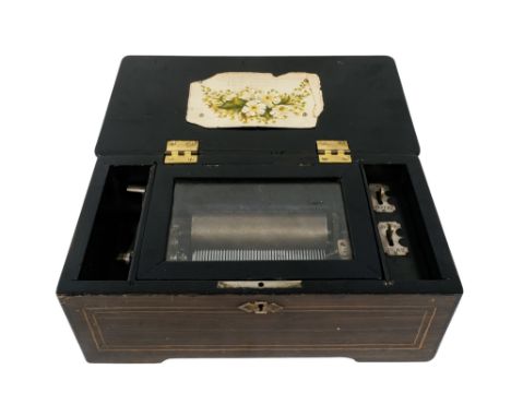 A 19th century Swiss music box - the rosewood case with decorative inlay, apparently playing four airs, 33cm wide, cylinder 1