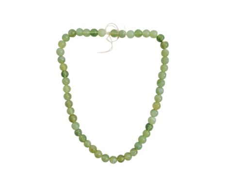 A jade necklace - of faceted bead form, length 60cm.